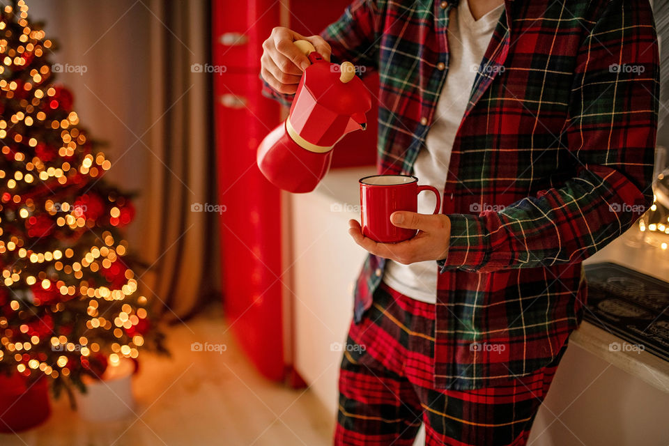 cup of coffee in a cozy festive Christmas atmosphere