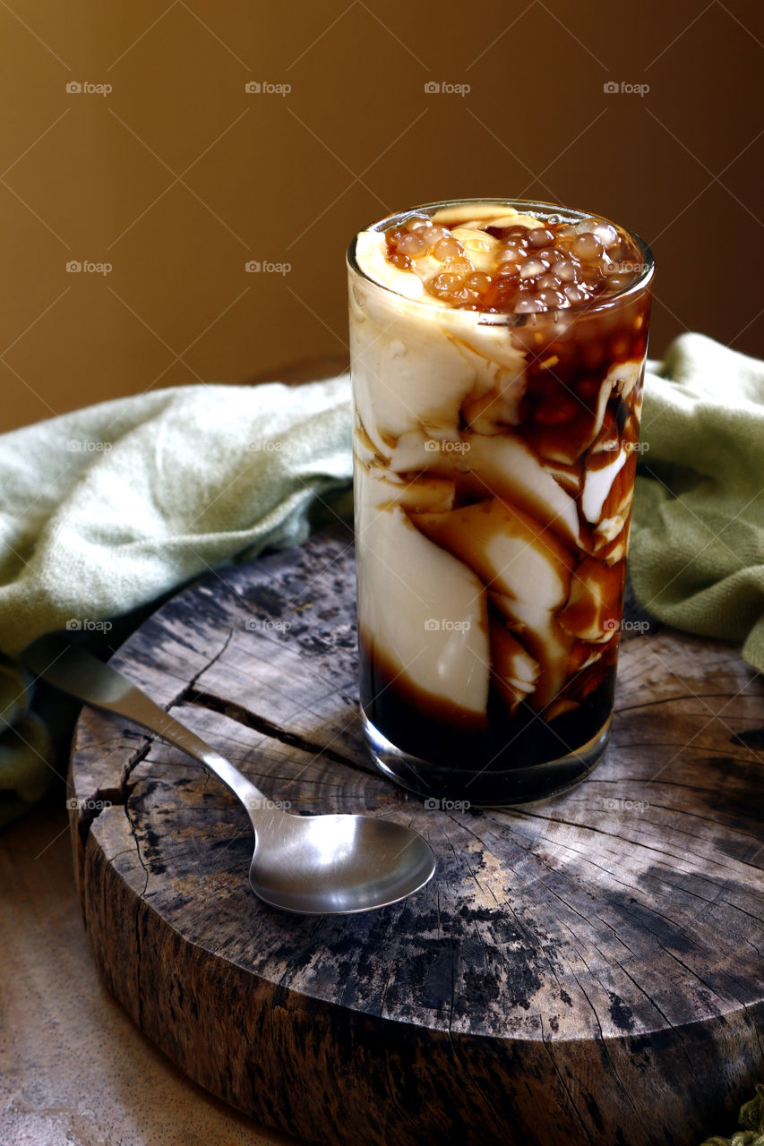 taho or soy bean curd with caramel sauce and tapuoca pearls
