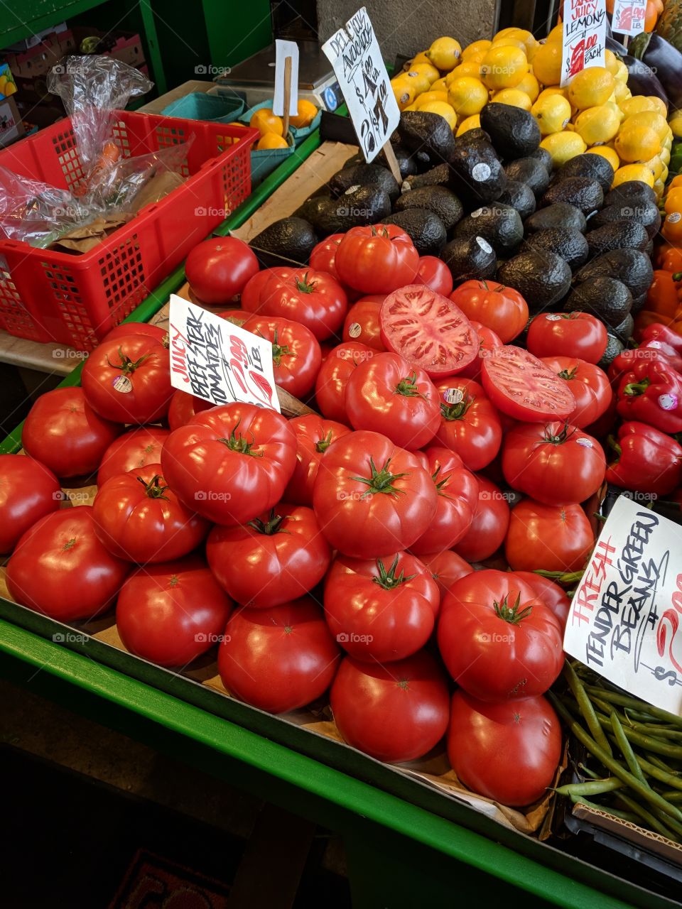 Bright, beautiful, beefsteak tomatoes, large in size, available and Pike's Market in Seattle Washington.