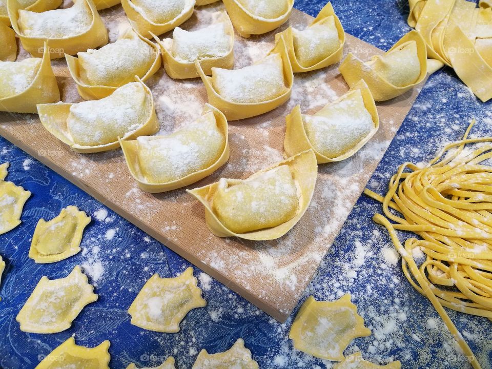 Ravioli filled with ricotta and spinach and handmade fettuccine