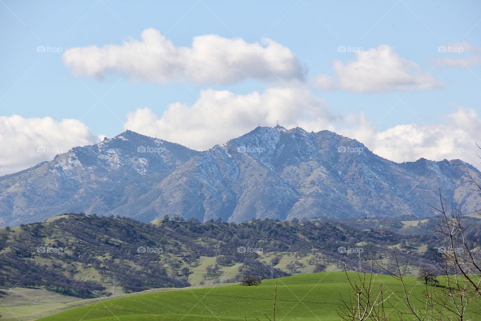 Mountain, snow and green grass