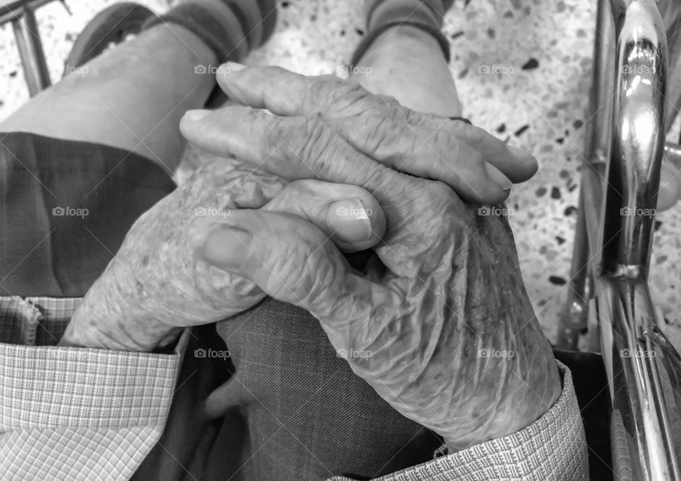 Close up aging woman hand join 