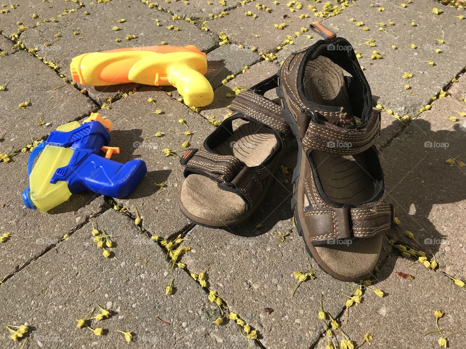 Sandals and water guns