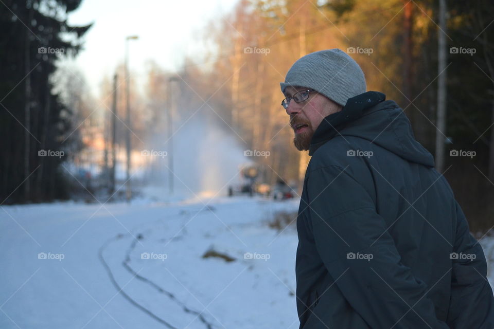 Close-up of man on snowy landscape