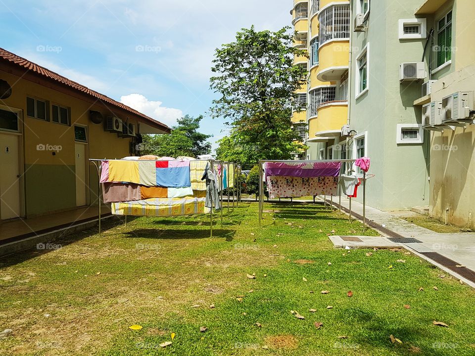 Tenants drying their laundry on sunny day