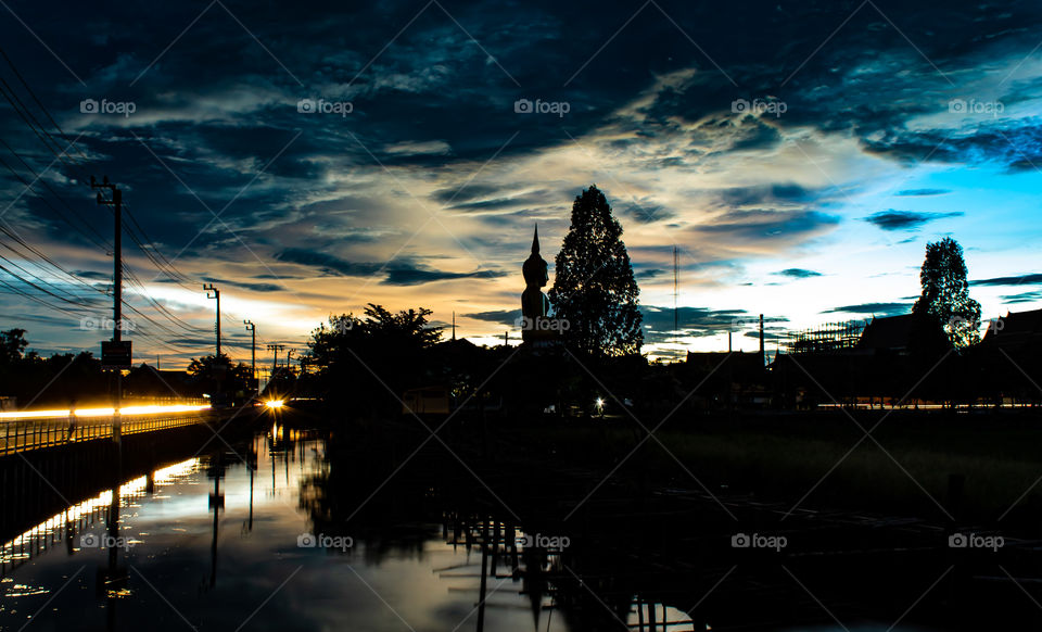 Sunset behind Wat Lad Pha Dook , Temple in Nonthaburi , Thailand.