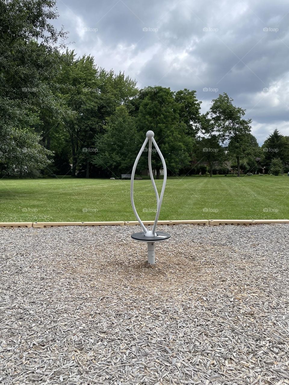 Spinning Merry Go Round at the park, modern merry go round, sculpture in the park, artistic expression 