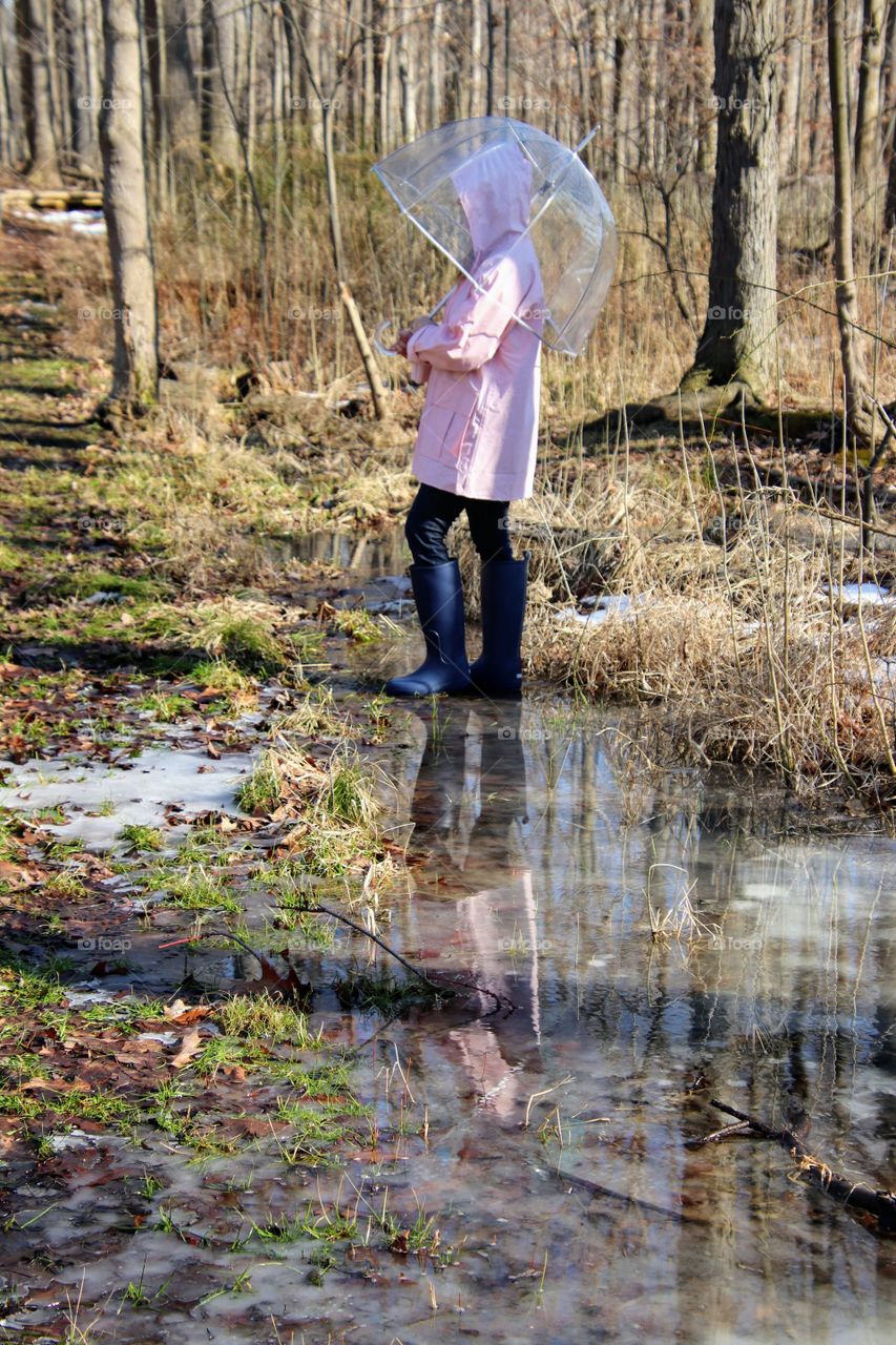 Woman wearing rain gear outdoors 