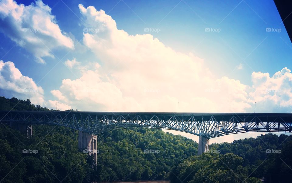 Highway bridge over the river with a beautiful sunny sky