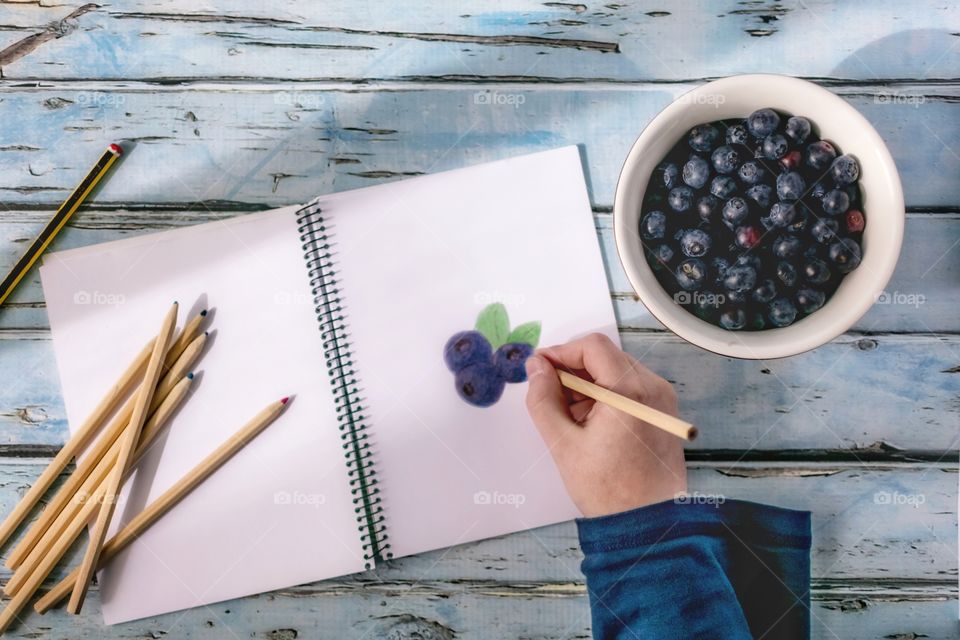 Drawing and eating blueberries