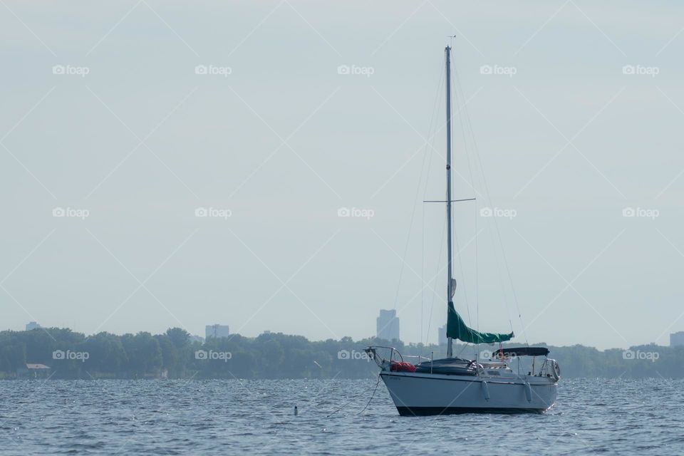 Yacht on the river on a misty morning