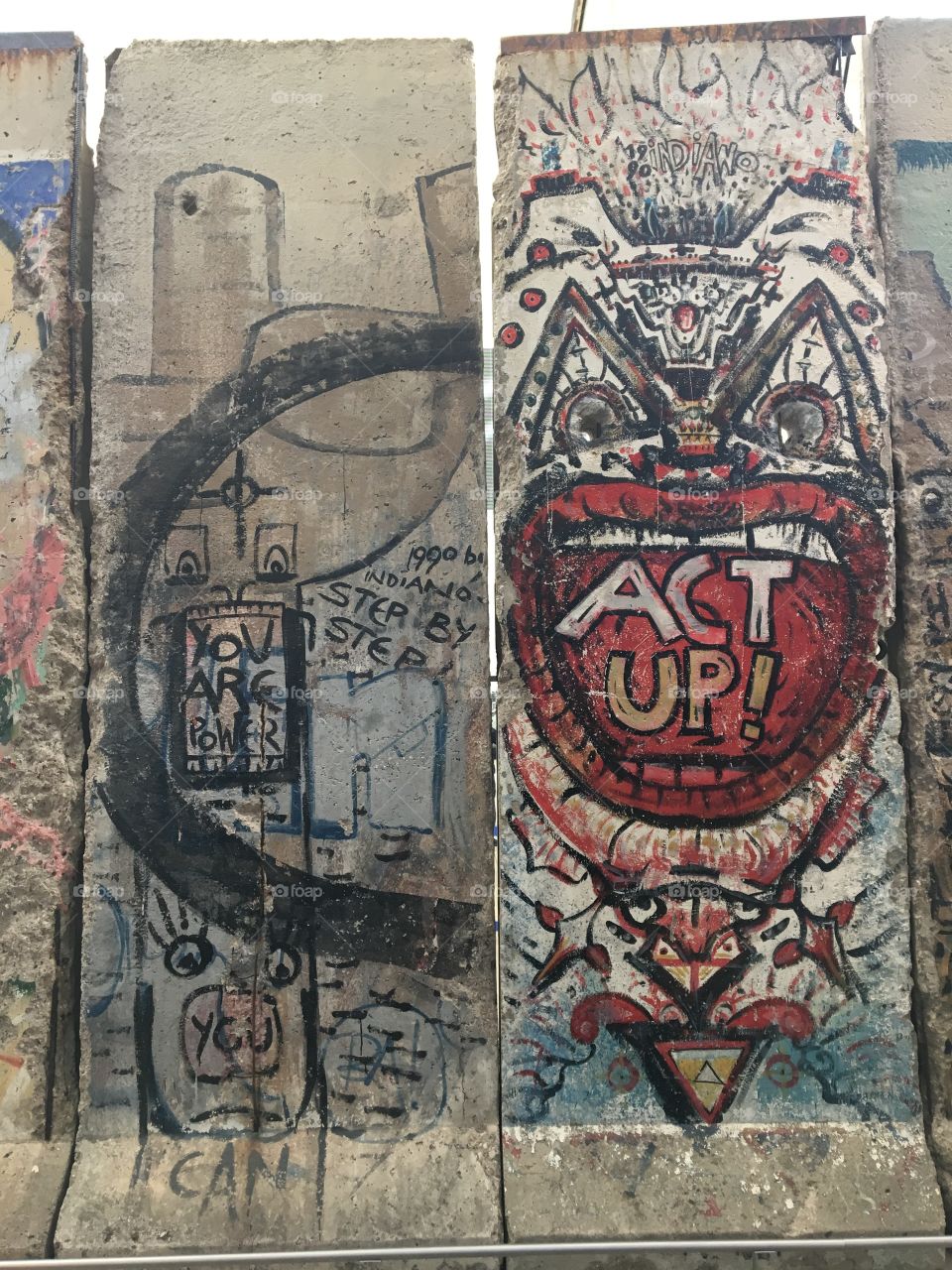 A piece of the Western side of the Berlin Wall that reminds us to speak up and act up in the face of oppression and fascism.