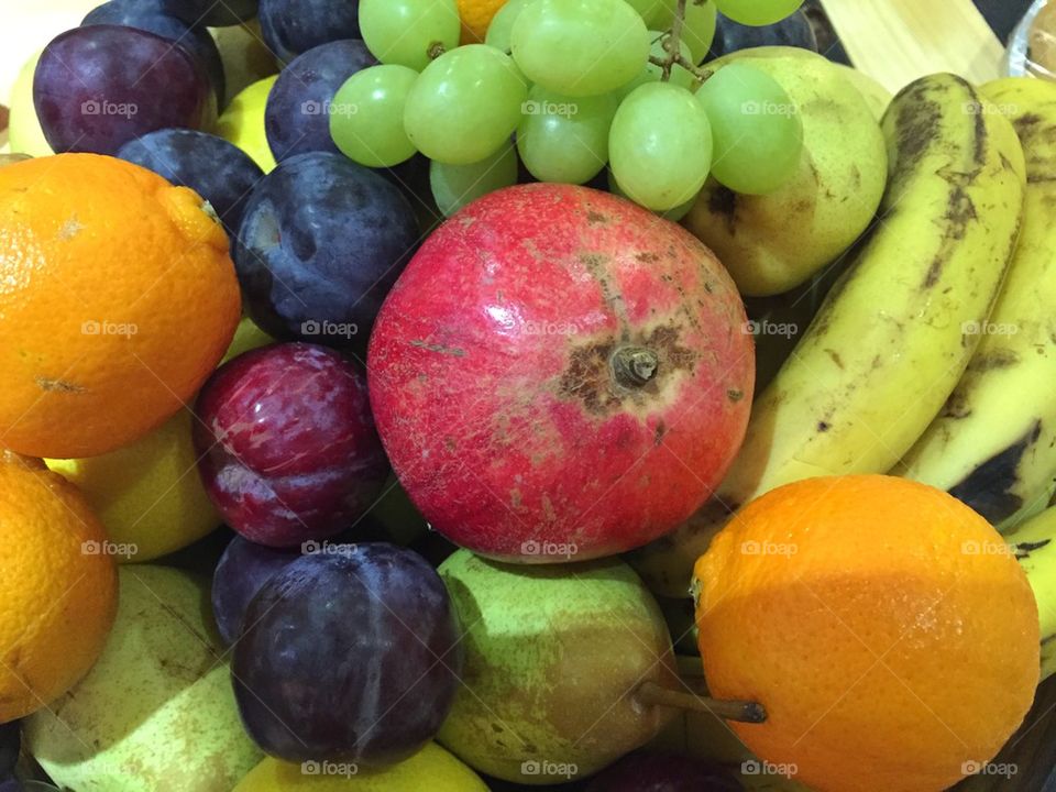 Mixed fruits- grapes, plums, banana, lemon , pomegranate, pear 