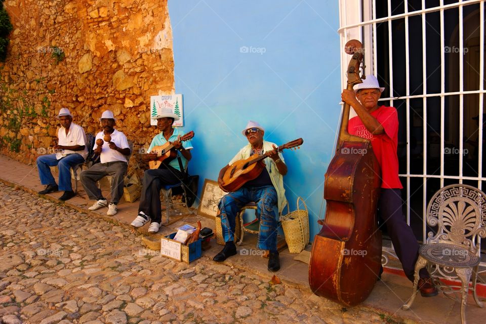 Street musicians in Trinidad, Cuba. A street band playing hot salsa in the streets of historic Trinidad, Cuba on Christmas Eve 2013
