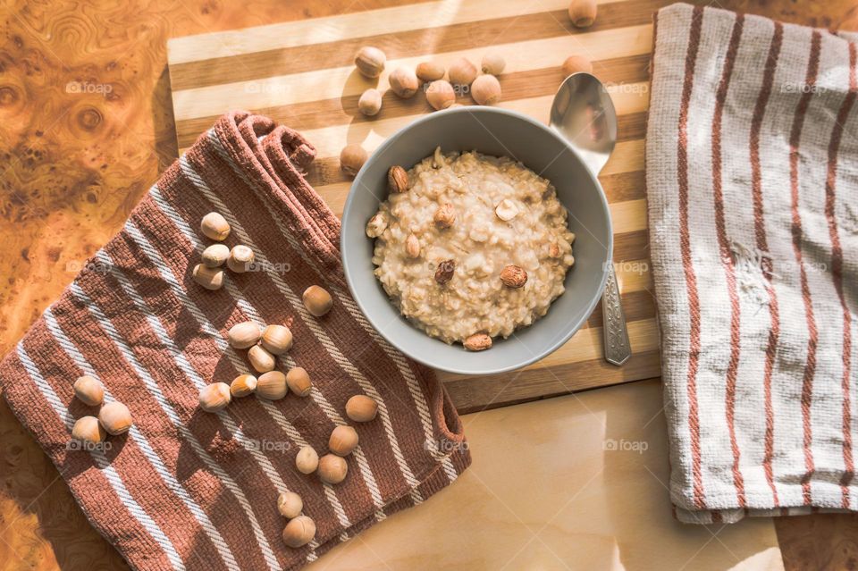 Cooked oatmeal in a deep gray plate.