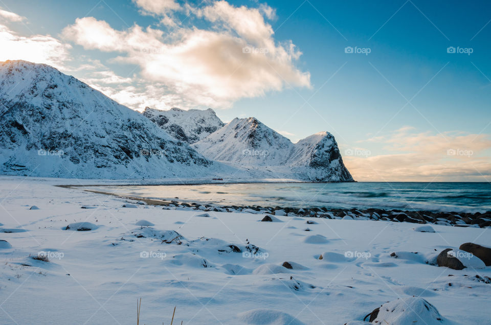 Scenic view of frozen sea and snowy mountain