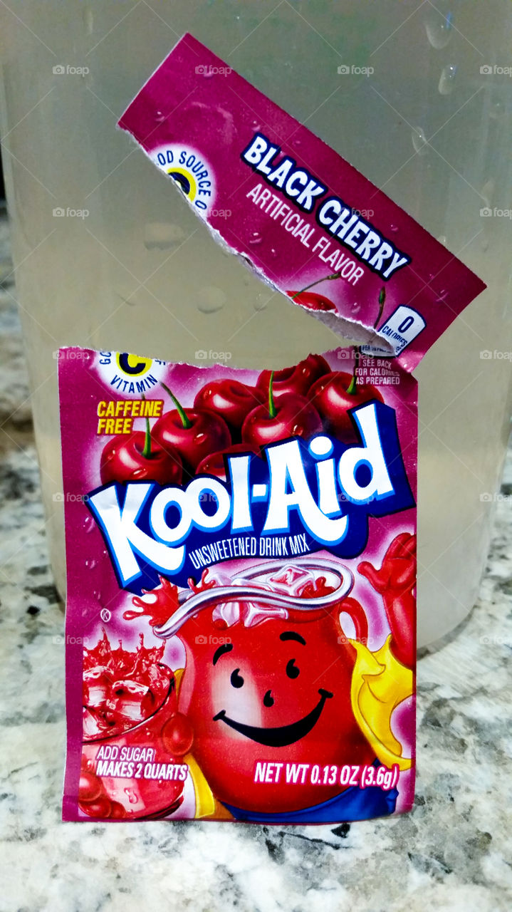 Making some black cherry Kool-aid for an after school snack