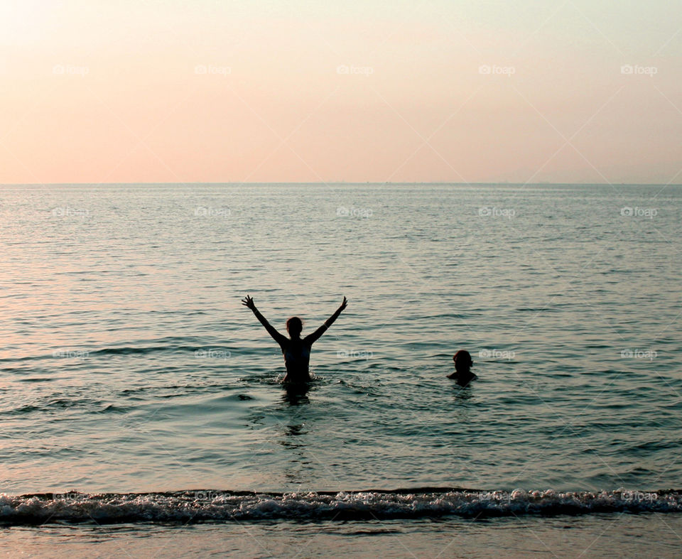 Enjoying a swim at sunset 