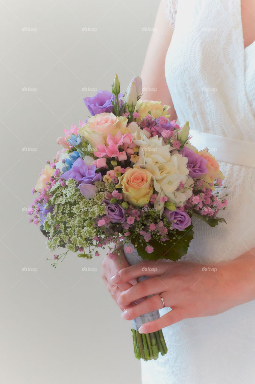 A colourful bouquet of flowers at a wedding