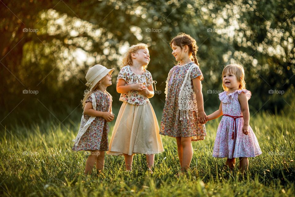Little girls friends boho outdoor portrait at sunset