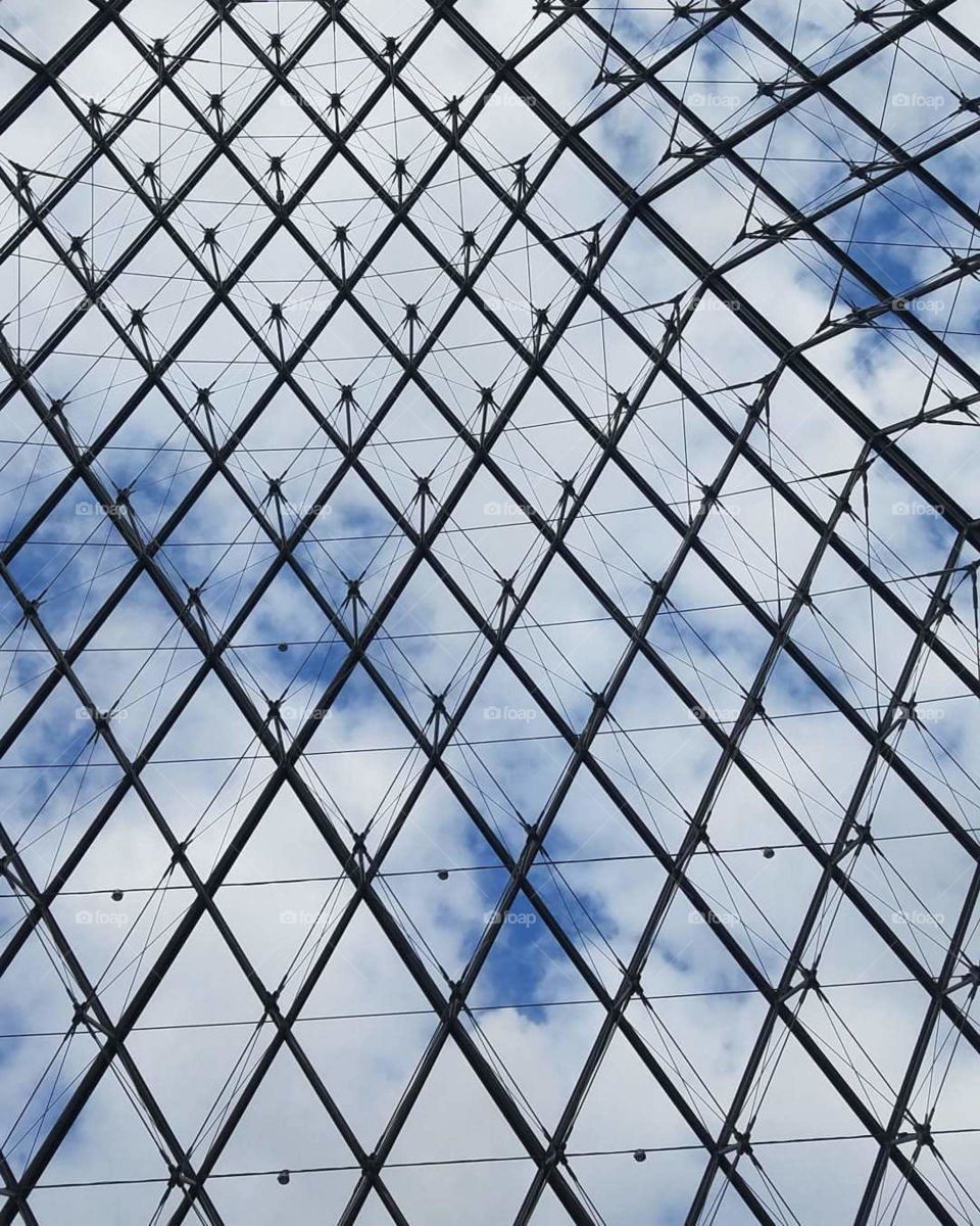 This was taken inside the Louvre Museum in Paris France. When i looked above the open ceiling this was the amazing view.