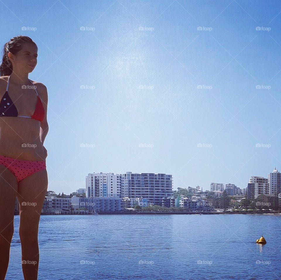 woman on beach standing in bikini