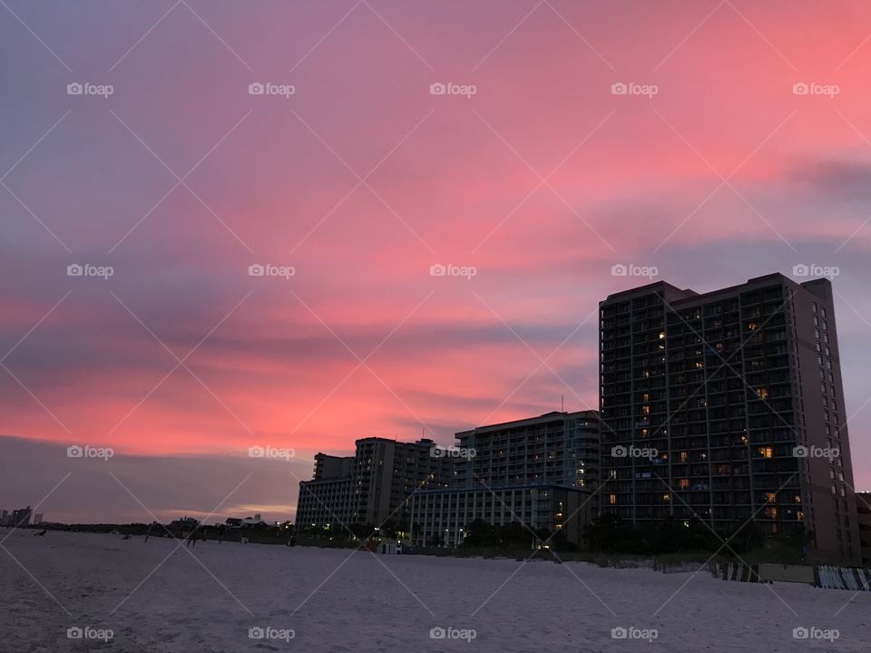 Pink sunset by the ocean in Myrtle Beach.