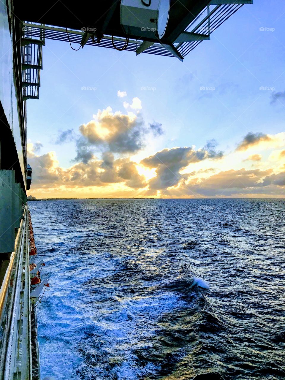 View of sunset and clouds Over the ocean from cruise ship