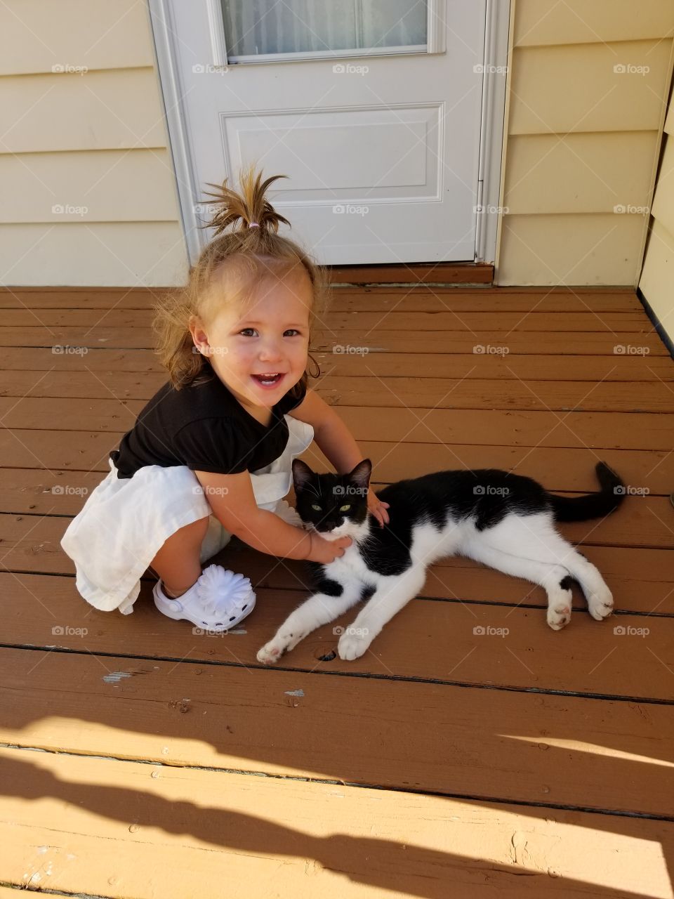 Baby with her Cat.