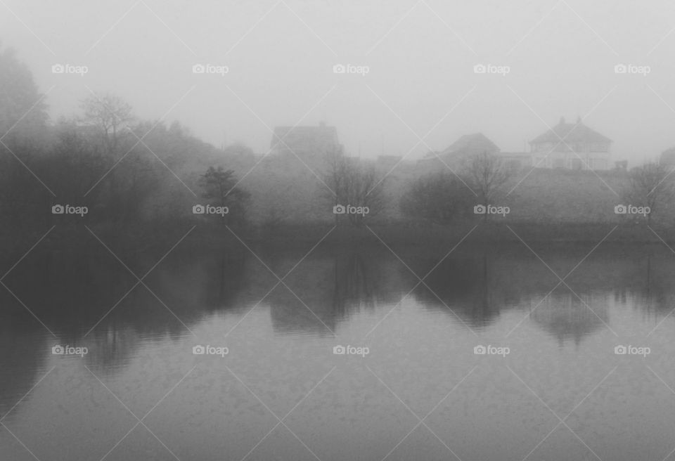 misty lake in black and white