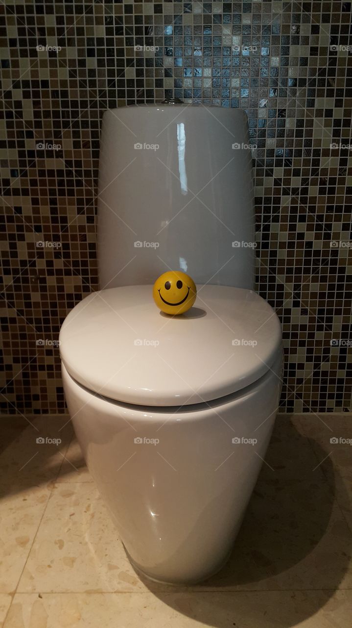 Happiness is every where. smiley at the restroom