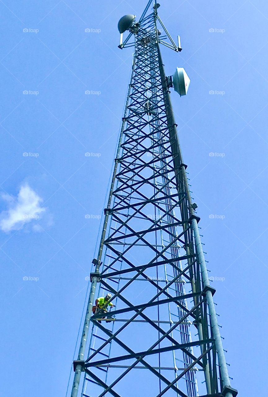 Man working on a cellular tower 