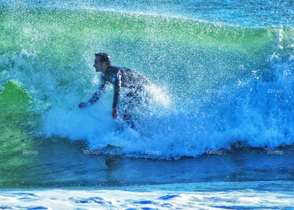 Riding waves at Año Nuevo beach in Northern California
