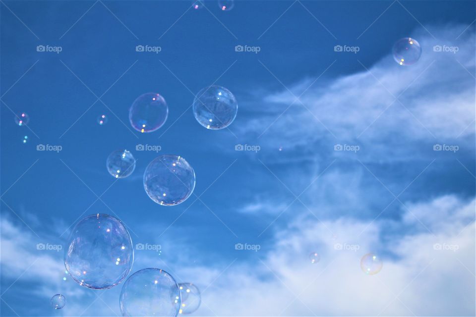 Low angle view of bubble against sky