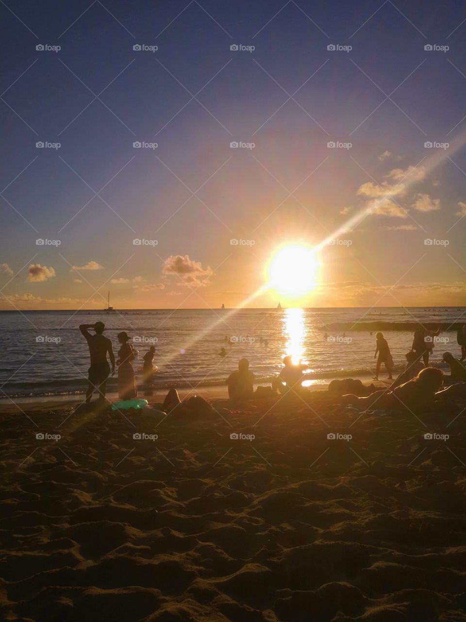 watching the sunset from Waikiki Beach