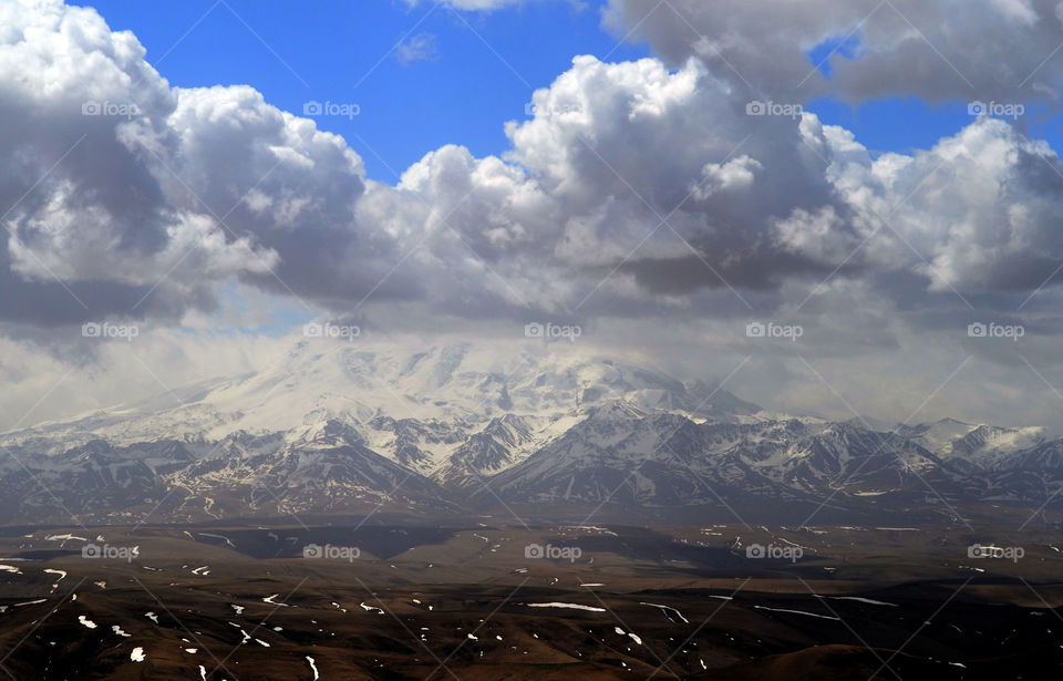 Clouds in the mountains of the North Caucasus. Caucasian ridge, Russia. View from the plateau Bermutyt on a rainy day