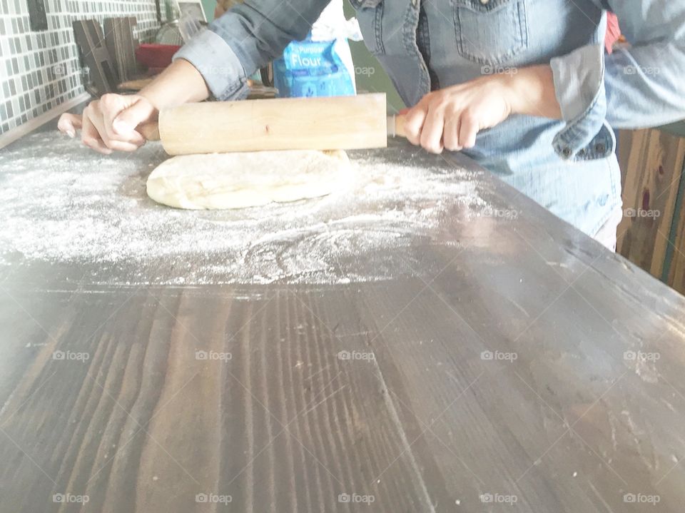 Baking rolls for her family 