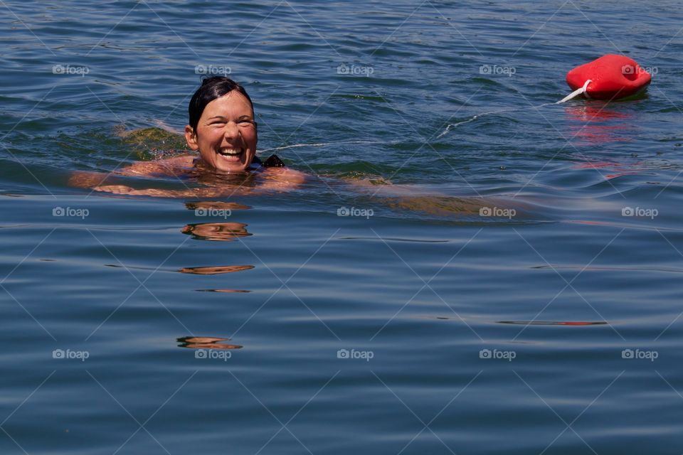 Happy Woman Swimming In Lake