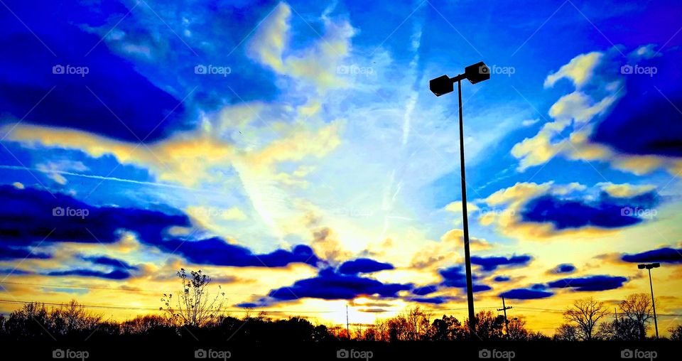 sometimes it pays to look up....was leaving from paying a ticket, pissed off, upset, and lighter in my wallet ....then I noticed the bright blue sky with the sun setting down and realized everything was gonna be alright....cue the Bob Marley