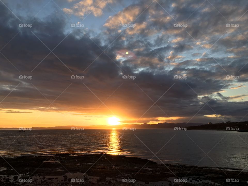 Reflection of sunlight at sea during sunset