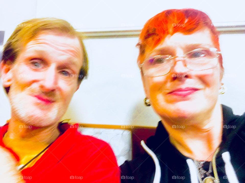 The comedic duo at its best, smiling to each other and the audience: “Timothy Trespas” and “Petra Schiller” waiting for the face to face doctor’s visit at “Mount Sinai” hospital on the “Upper East Side” of “Manhattan”. 2020. Hypnotic Productions