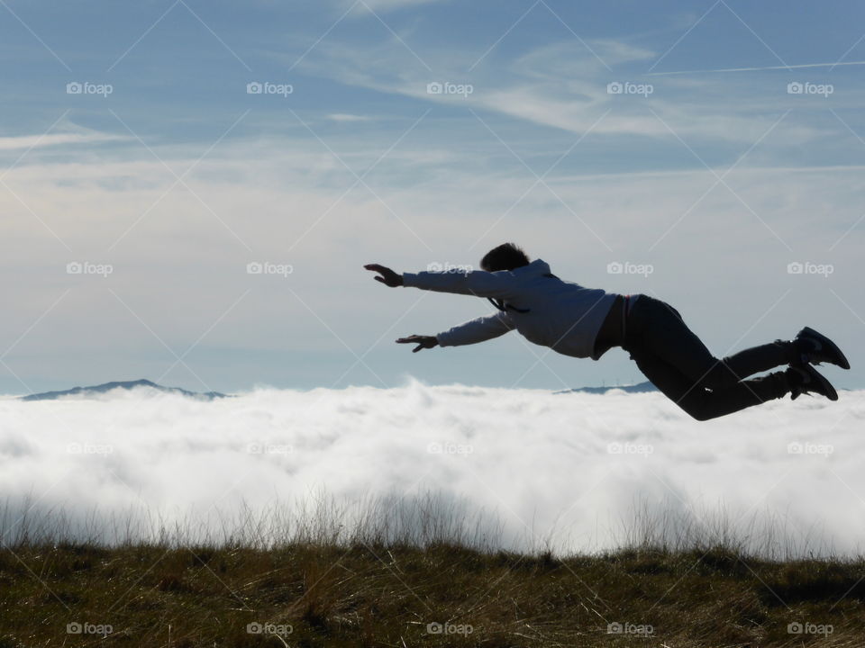 Superman is coming from over the clouds