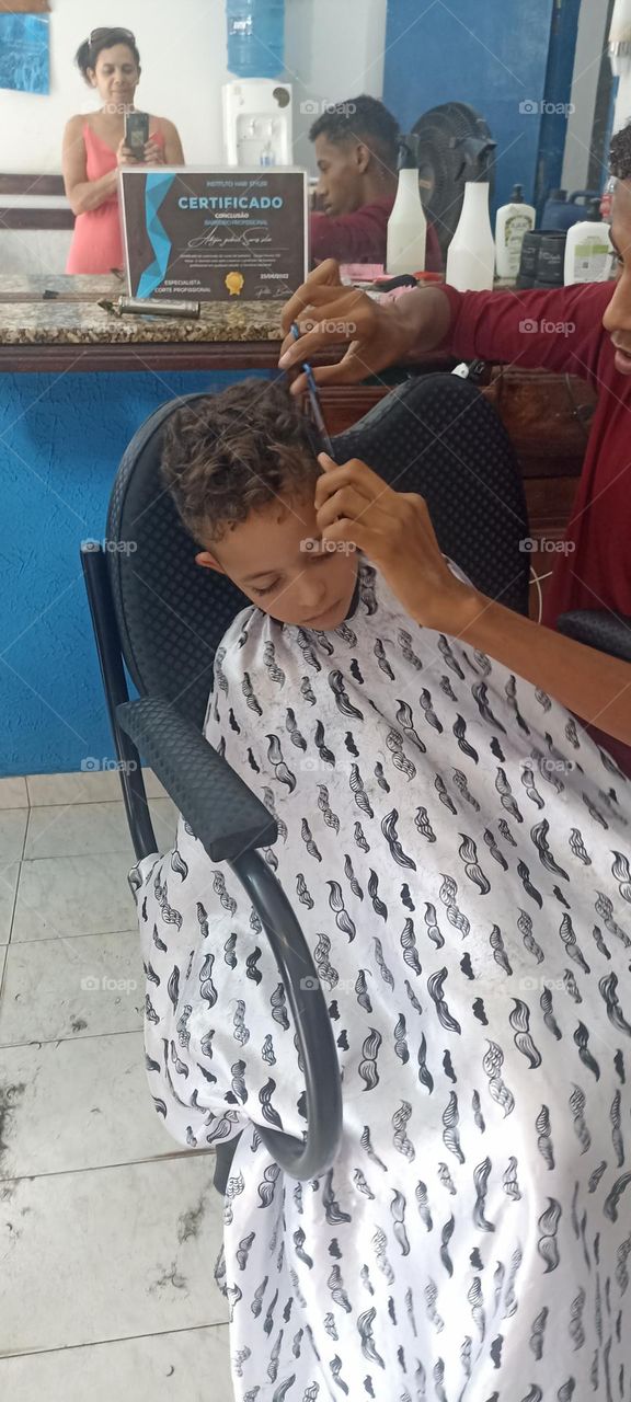 Boy falls asleep while cutting his hair