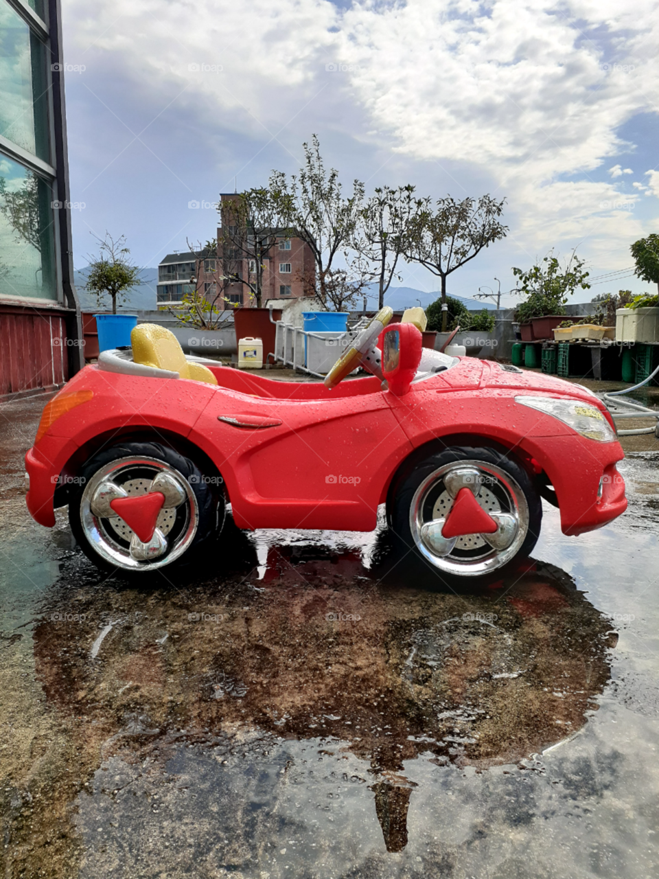 wet red car after the rain