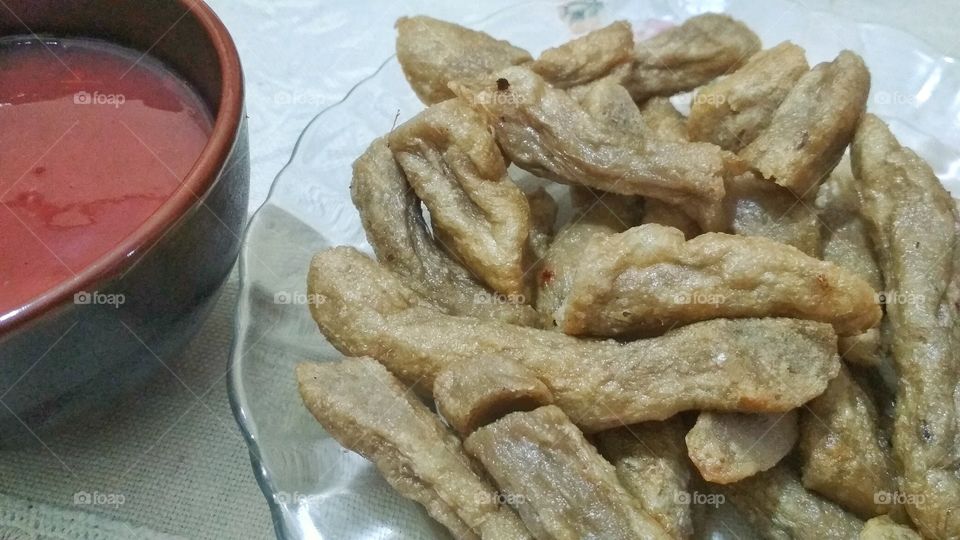 'Keropok Lekor' is a deep fried snack that can be taken anytime, sometime they are boiled also. Usually dipped in it special chilli sauce. Now can be found eaten with blackpepper sauce or even with cheese.