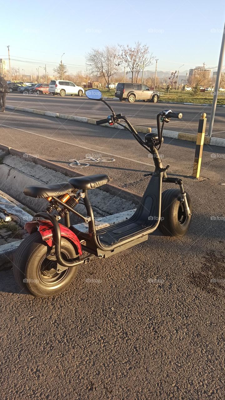 scooter staying along