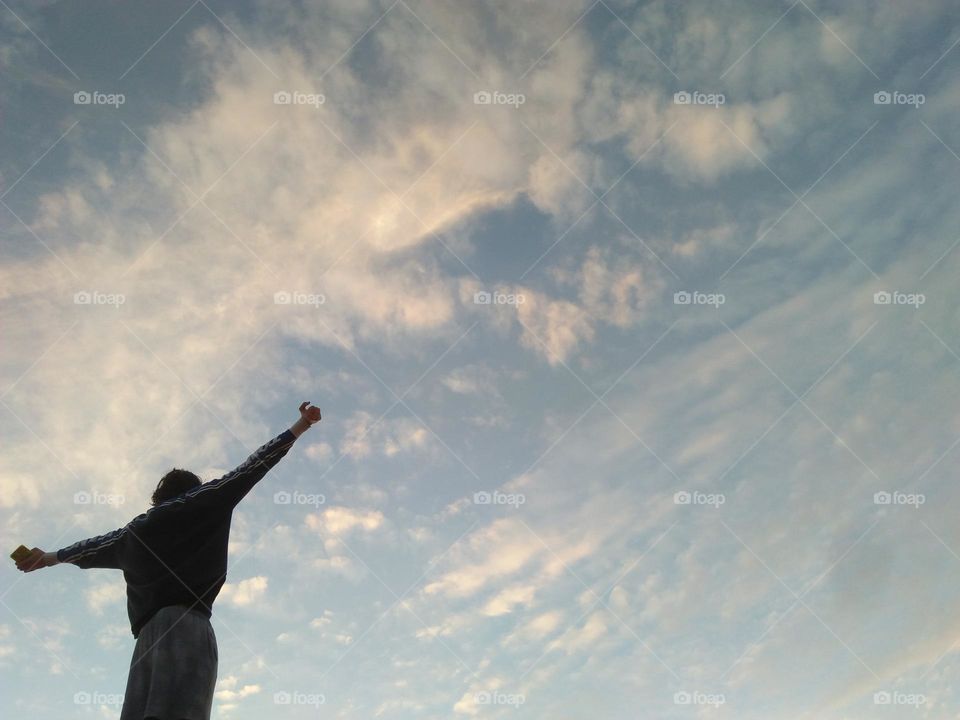 Standing man looking at the sky.