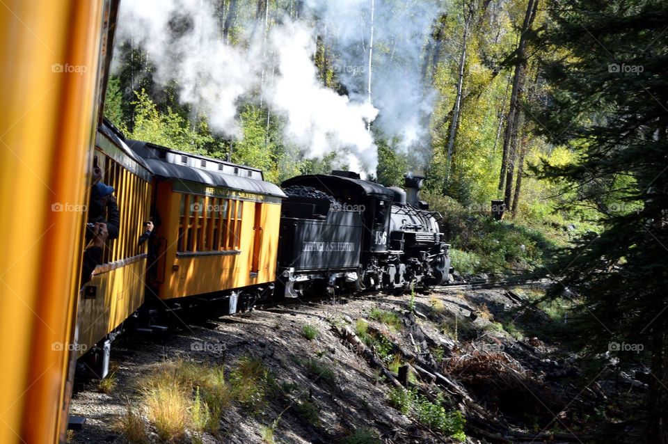 The Durango & Silverton Narrow Gauge Railroad line was built in 1881 and 1882. A historic coal-fired steam engine hauls passengers between the two cities. silver and gold ore from the San Juan Mountains. In this photo, you can see the coal car.