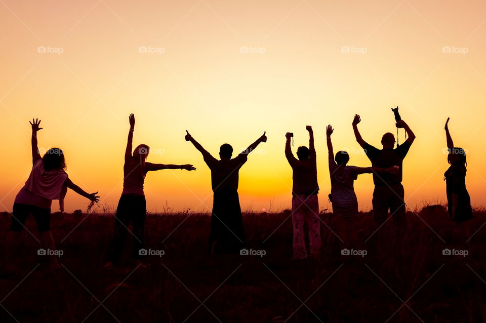 Silhouette of people gesturing