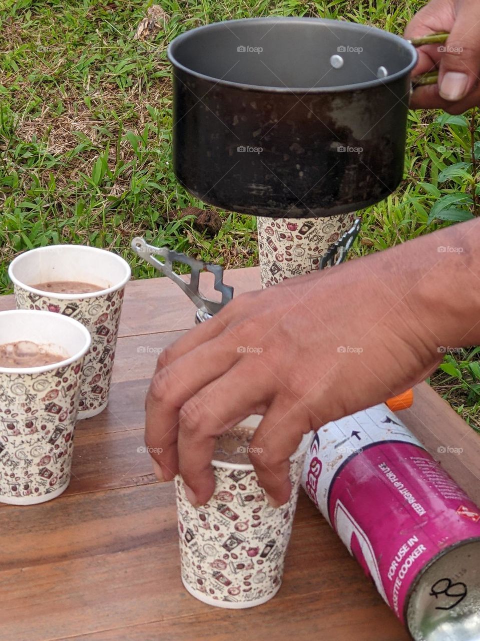 Preparing coffee for a picnic in the park